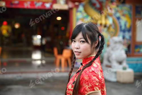 Preview: Beauty Woman Wear Red Cheongsam Looking And Smile In Chinese New Year