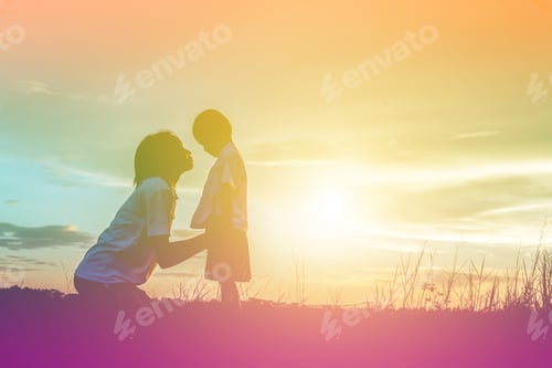 Preview: Silhouettes Of Mother And Little Daughter Walking At Sunset