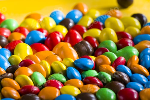 Preview: A Closeup Of A Group Of Colorful Sweet Candies Scattered On The Table - Perfect For Wallpapers