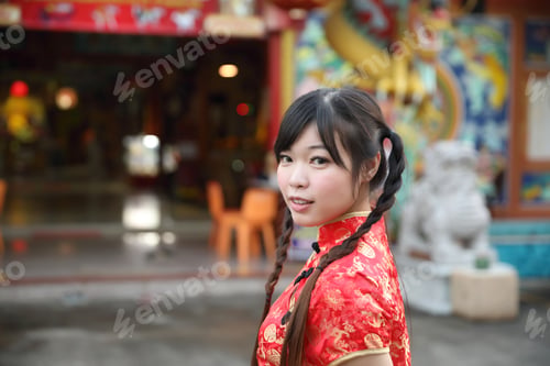 Preview: Beauty Woman Wear Red Cheongsam Looking And Smile In Chinese New Year