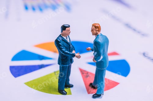 Preview: Miniature People : Businessman Standing On A Paper Graph Chart ,Developing A Teamwork Concept