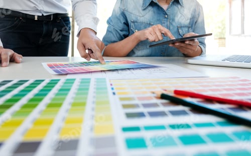 Preview: Interior Aechitect Designer Team At Discussing On Project Of Building Plan With Colour Chart