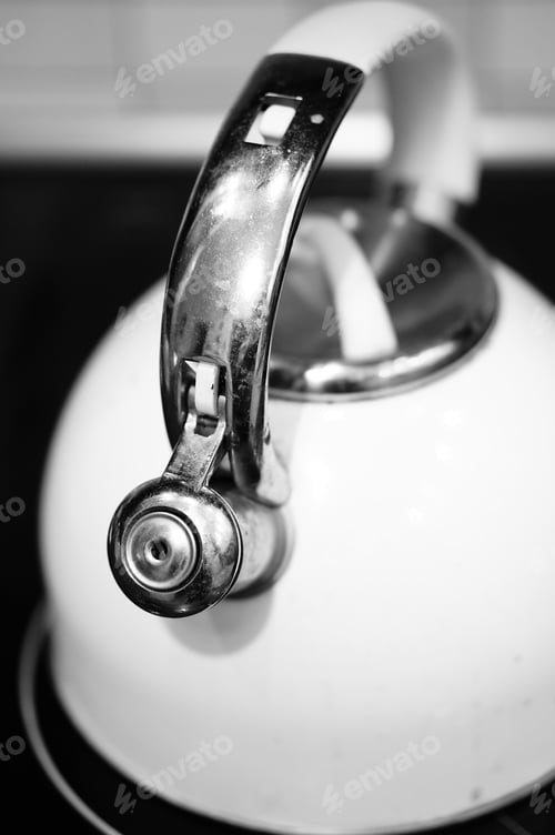 Preview: A Vertical Shot Of A Kettle On The Stove In The Kitchen