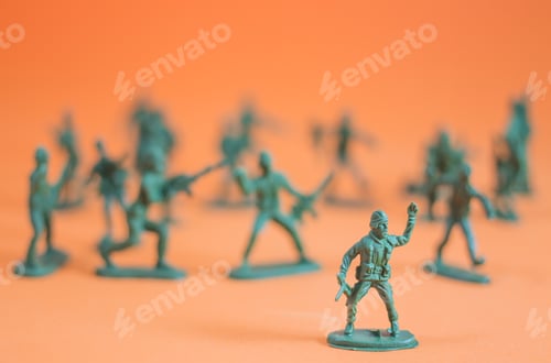 Preview: Closeup Of Action Mini Toy Soldier On Orange Background
