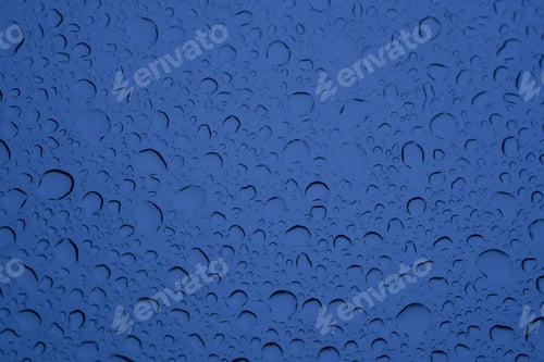 Preview: A Closeup Shot Of Water Big And Small Drops On Blue Glass - Perfect For Background
