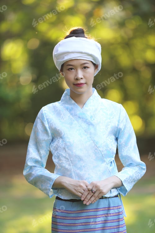 Preview: Portrait Of Thai Young Woman With Traditional Thai Dress In Thai Temple With Tree And Sunrise