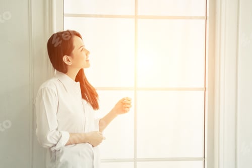 Preview: Young Beautiful Woman Standing Against Window Watching At Sunrise In The Morning.