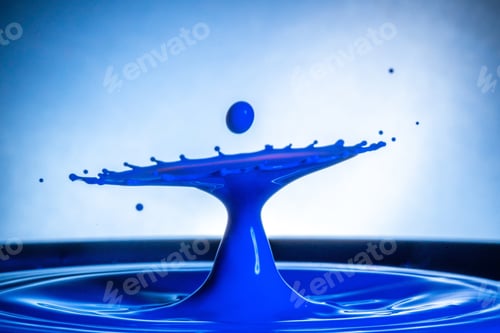 Preview: A Closeup Of A Cool Blue Water Splash Against A Blurred Background - Great For Wallpapers