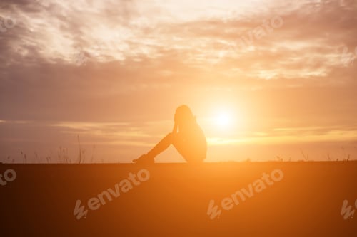 Preview: Sad And Depressed Woman Sitting Alone
