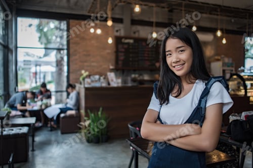 Preview: Portrait Of Young Woman Smiling In Coffee Shop Cafe