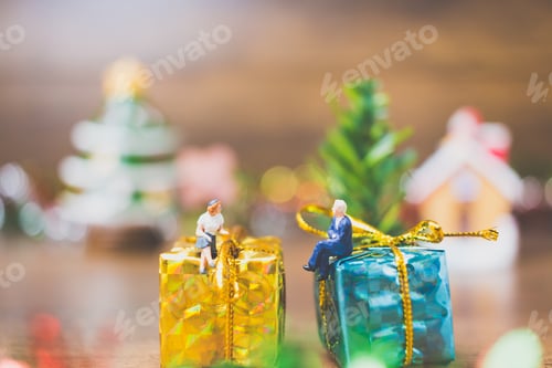 Preview: Miniature People On Gift Box With Christmas Day Celebration Background