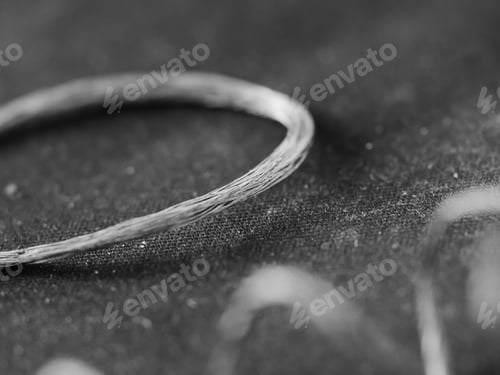 Preview: A Grayscale Shot Of A Curvy Copper Wire