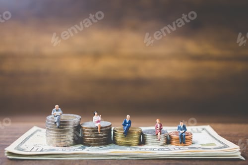 Preview: Miniature People Businessman On Money On Wooden Backhground