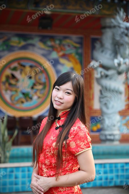 Preview: Beauty Woman Wear Red Cheongsam Looking And Smile In Chinese New Year