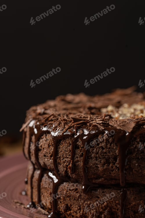 Preview: A Closeup Of A Freshly Made Delicious Cake With Glazed Chocolate On A Plate