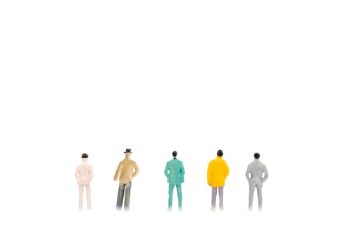 Preview: Group Of Miniature Businessman On White Background