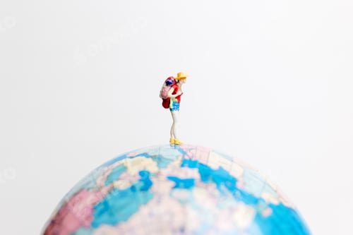Preview: Miniature People Figure Standing On The Globe World Map With White Background And Copy Space As