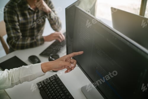 Preview: Young Startup Programmers Sitting At Desks Working On Computers Screen For Developing Programming
