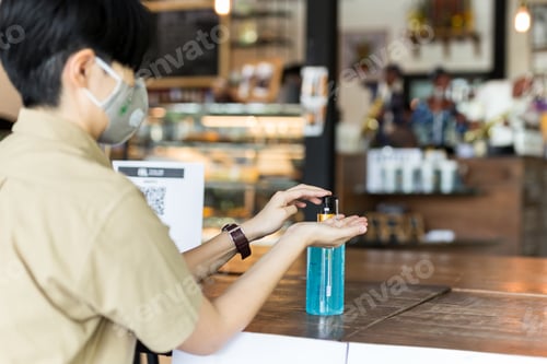 Preview: Woman Using Alcohol Gel Cleaning Hands For Coronavirus Protection.
