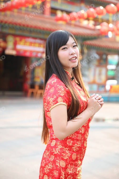 Preview: Beauty Woman Wear Red Cheongsam Looking And Smile In Chinese New Year