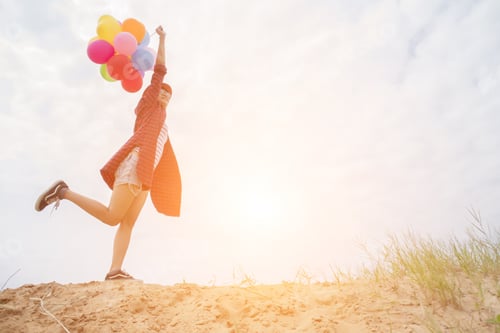 Preview: Teenage Girls Holding Colorful Balloons In The Bright Sky And Smiled Happily.