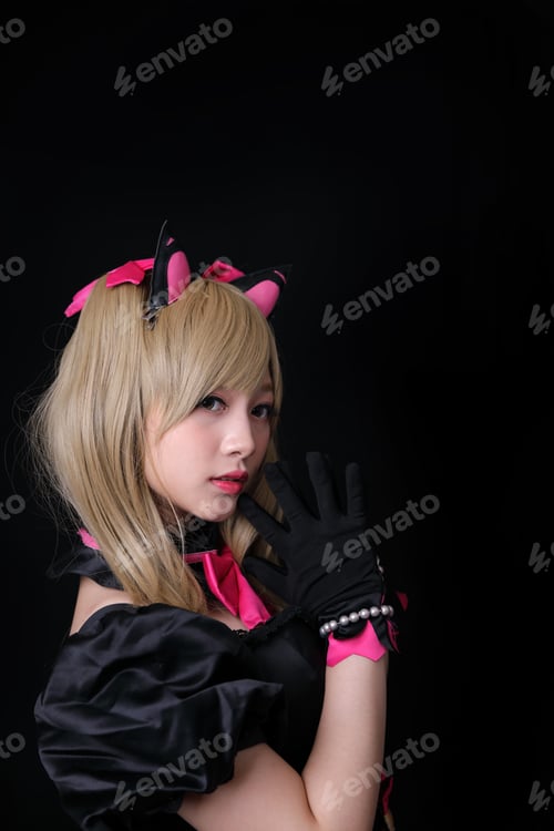 Preview: Asian Young Woman With Game Costume Dress In Black Background