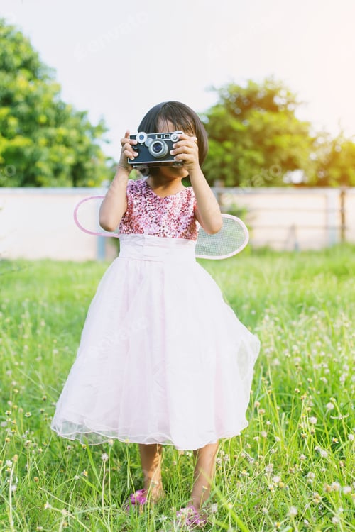 Preview: Cute Little Happy Girl With Vintage Photo Camera Outdoors