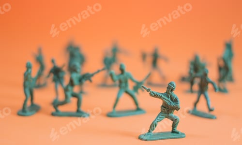 Preview: Closeup Of Action Mini Toy Soldier On Orange Background