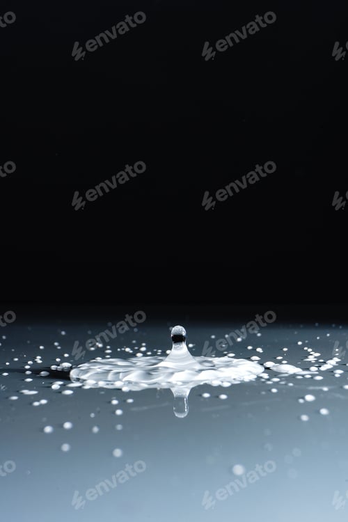 Preview: A Vertical Shot Of Milk Spilled On A Smooth Surface