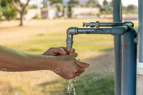 Preview: Man Washing Hands From Plumbing Tap Outdoor.