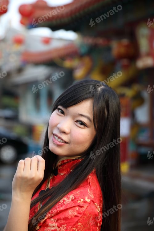 Preview: Beauty Woman Wear Red Cheongsam Looking And Smile In Chinese New Year