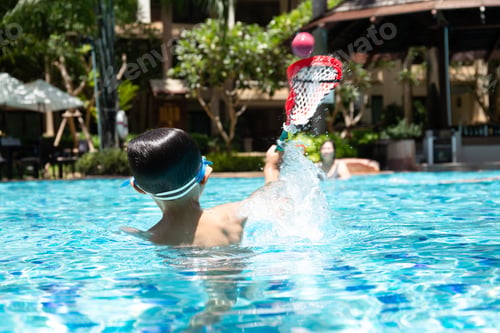 Preview: Little Boy Playing A Ball Game In Swimming Pool With Grandmother In Summer