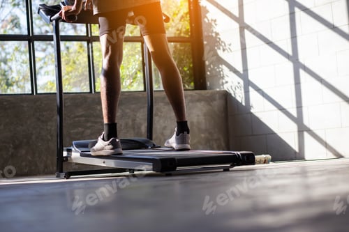 Preview: Young Men Exercise On An Automatic Treadmill