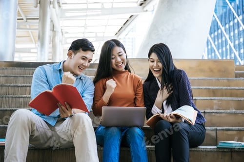 Preview: Group Students Studying Researching On Laptop Together Sitting At College.