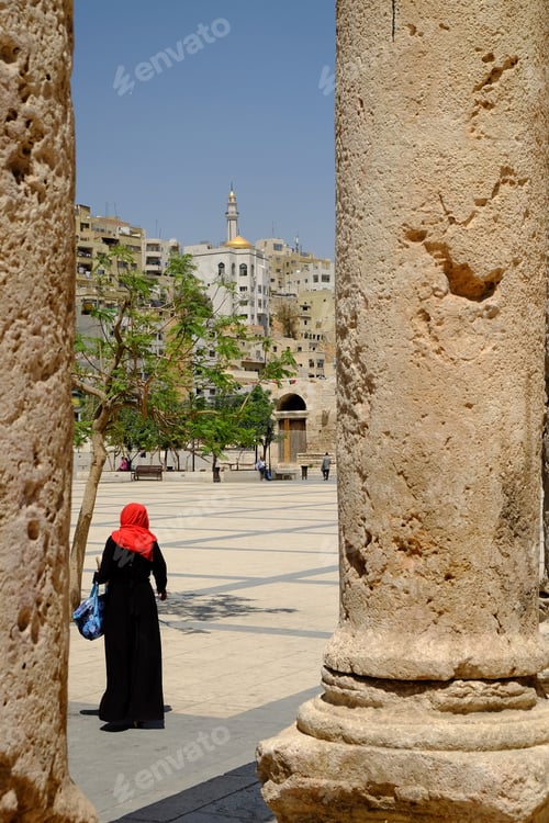 Preview: A Vertical Shot Of A Person Walking Near The Amman Roman Amphitheatre, Jordan