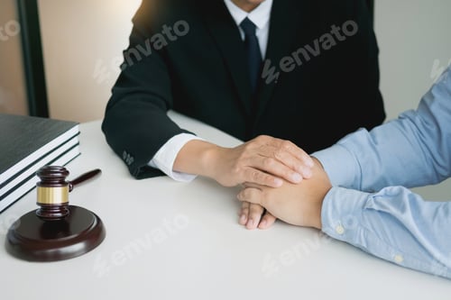 Preview: Justice And Law Concept. Consultant Holding Client Hands In Law Firm.
