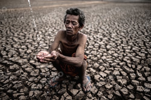 Preview: An Elderly Man Sitting In Touch With Rain In The Dry Season, Global Warming, Selection Focus