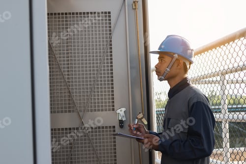 Preview: Engineer Or Electrician Working On Checking And Maintenance Equipment At Green Energy Solar Power