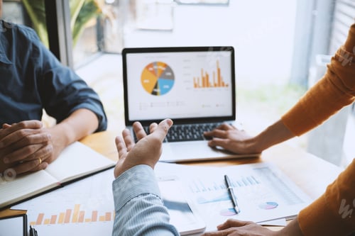 Preview: Businesspeople Discussing Financials in a Bright Modern Office