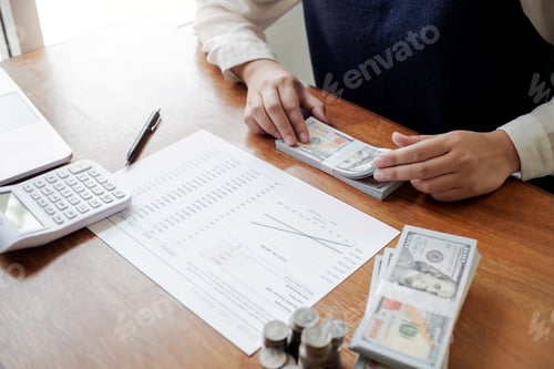 Preview: Business People Working With Dollar Bill And Coin Stack In Office Room.