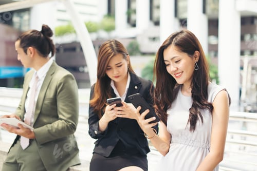 Preview: Business People Using Smartphone While Together
