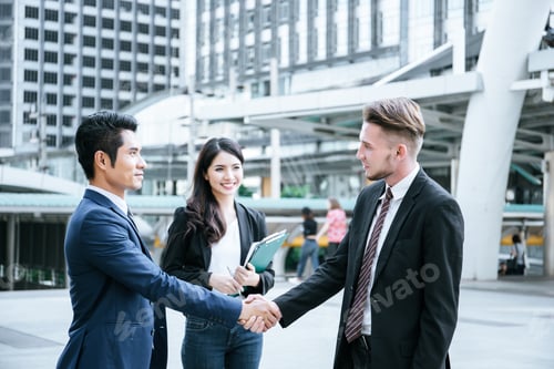 Preview: Business Partner Work Hands Shaking While Looking At Successful Work At Tablet. Business Concept.