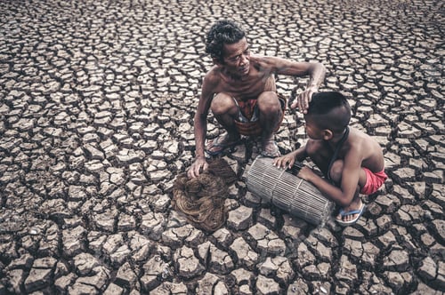 Preview: Man and Boy Fishing on Cracked Dry Earth