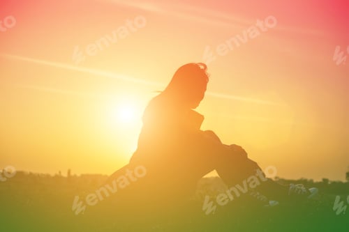 Preview: Silhouette Of Woman Praying Over Beautiful Sky Background