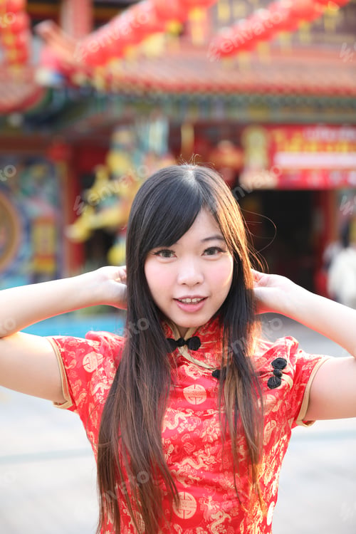Preview: Beauty Woman Wear Red Cheongsam Looking And Smile In Chinese New Year