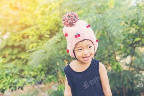 Preview: Little Cute Asian Girl Standing Among The Purple Flower Field Sunshine Day. Freedom Enjoying With