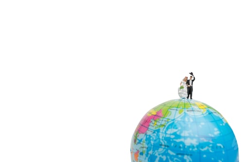 Preview: Miniature People Wedding , Bride And Groom Couple On The Globe On White Background