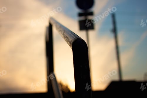 Preview: A Closeup Shot Of A Metal Railing On A Sunset Background