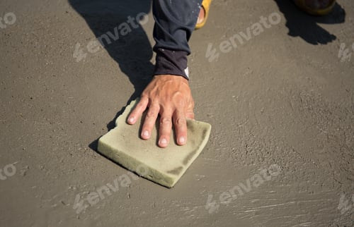 Preview: Worker Smooth Concrete Floor With Sponge In Construction Sites