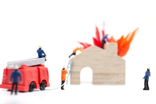 Preview: Miniature People : Firefighters With Water Pistols Are Taking Care Of A Fire Emergency